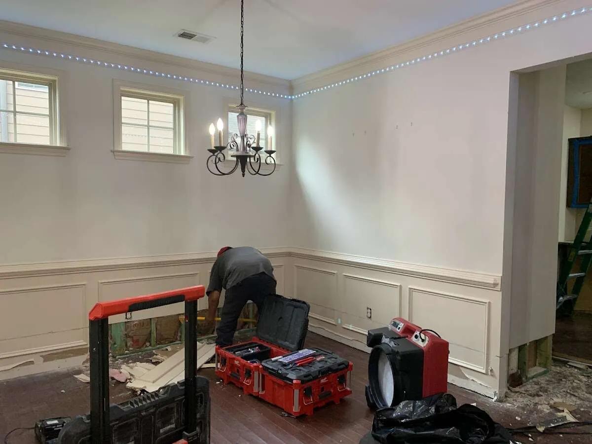 Restoration technician with professional equipment in Groton